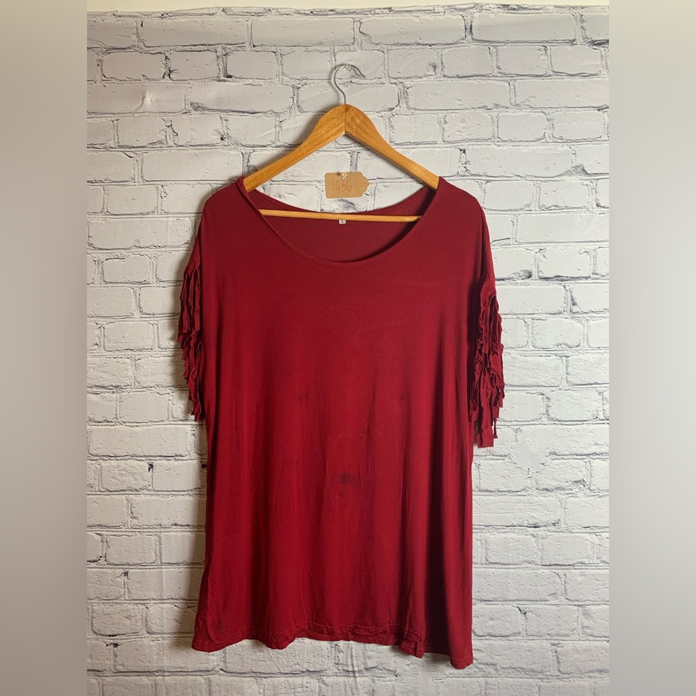 Cute red top with fringe sleeves!